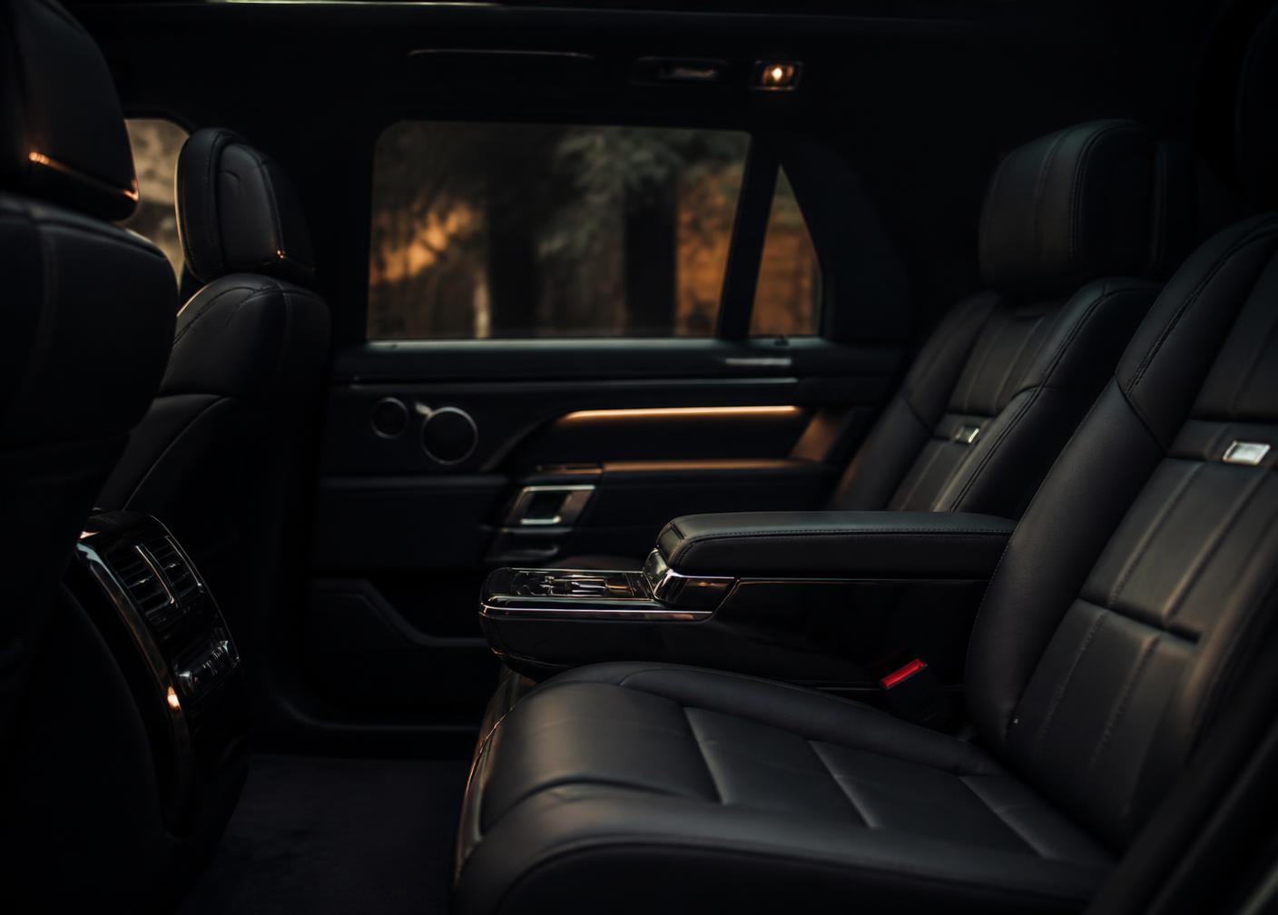 Black leather rear cabin interior of a luxury executive vehicle